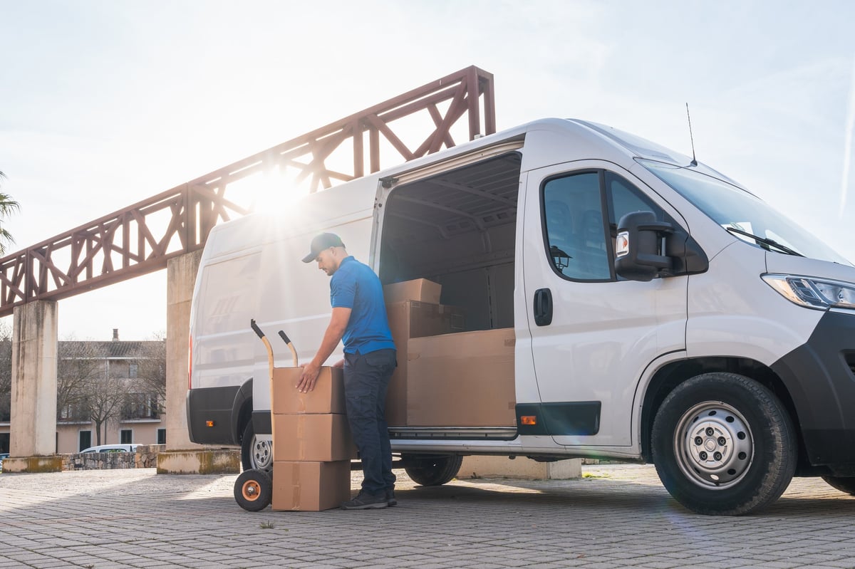Taycan Advisors last-mile Hypr delivery logistics review - delivery driver loading packages for optimized fulfillment