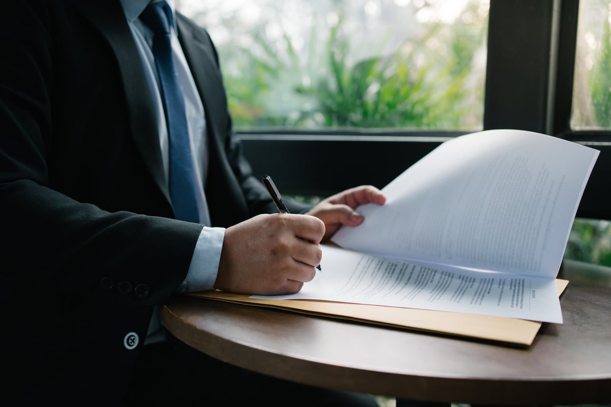 Brand manager reviewing brand architecture documents