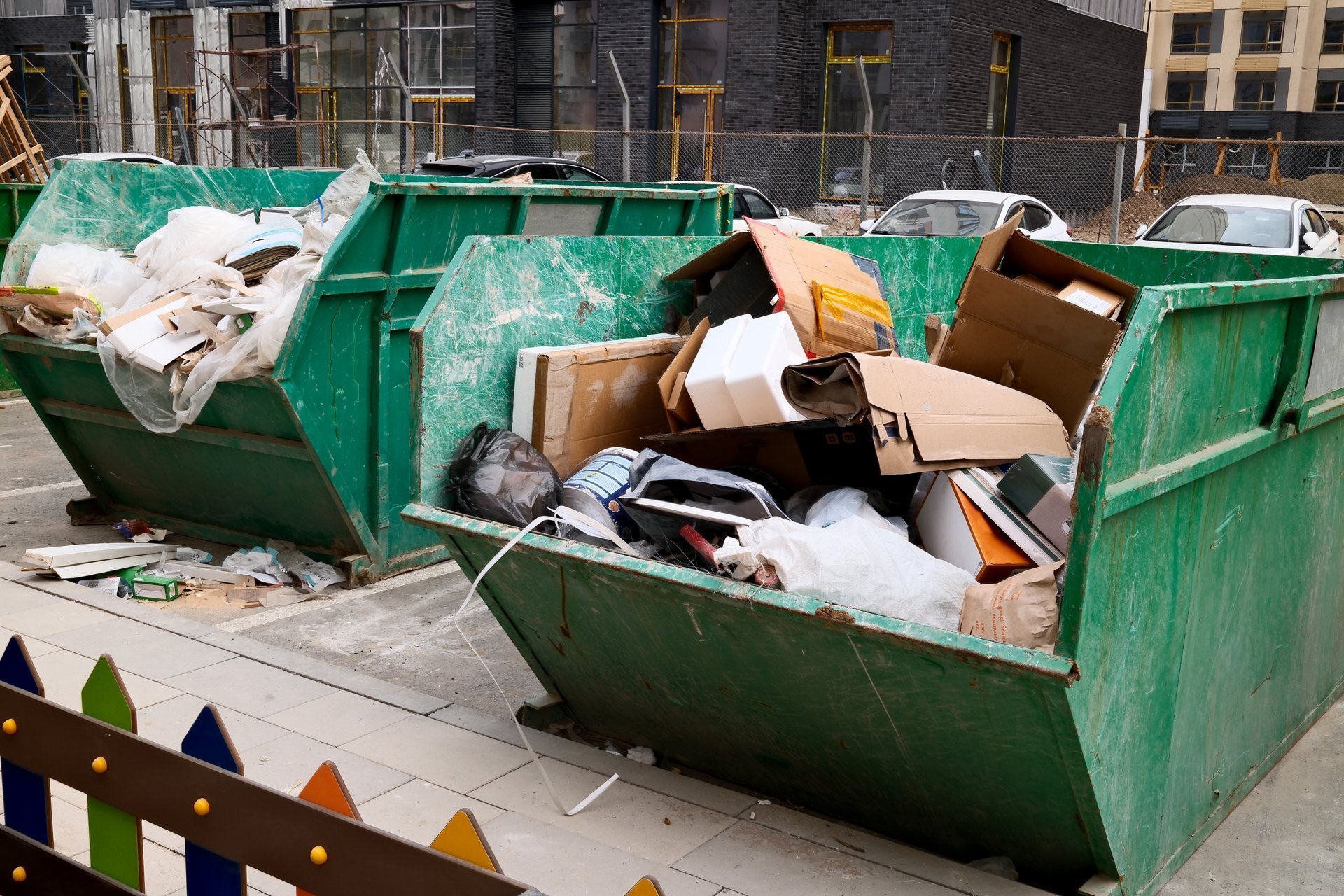 Overflowing construction skip at an urban site