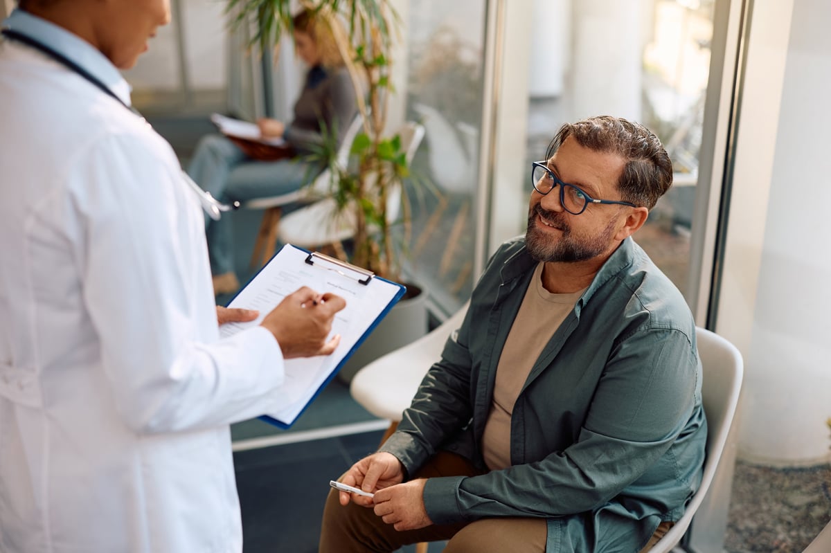 Patient communicating with a doctor in clinic waiting room