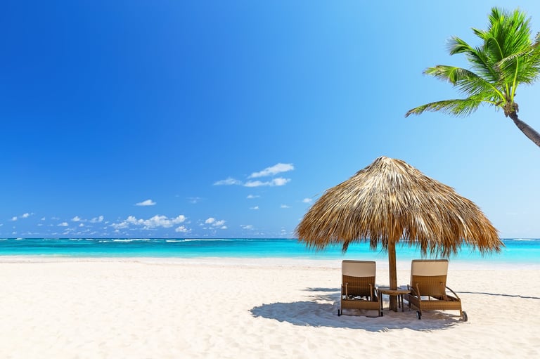Empty beach chairs on sunny day in Punta Cana