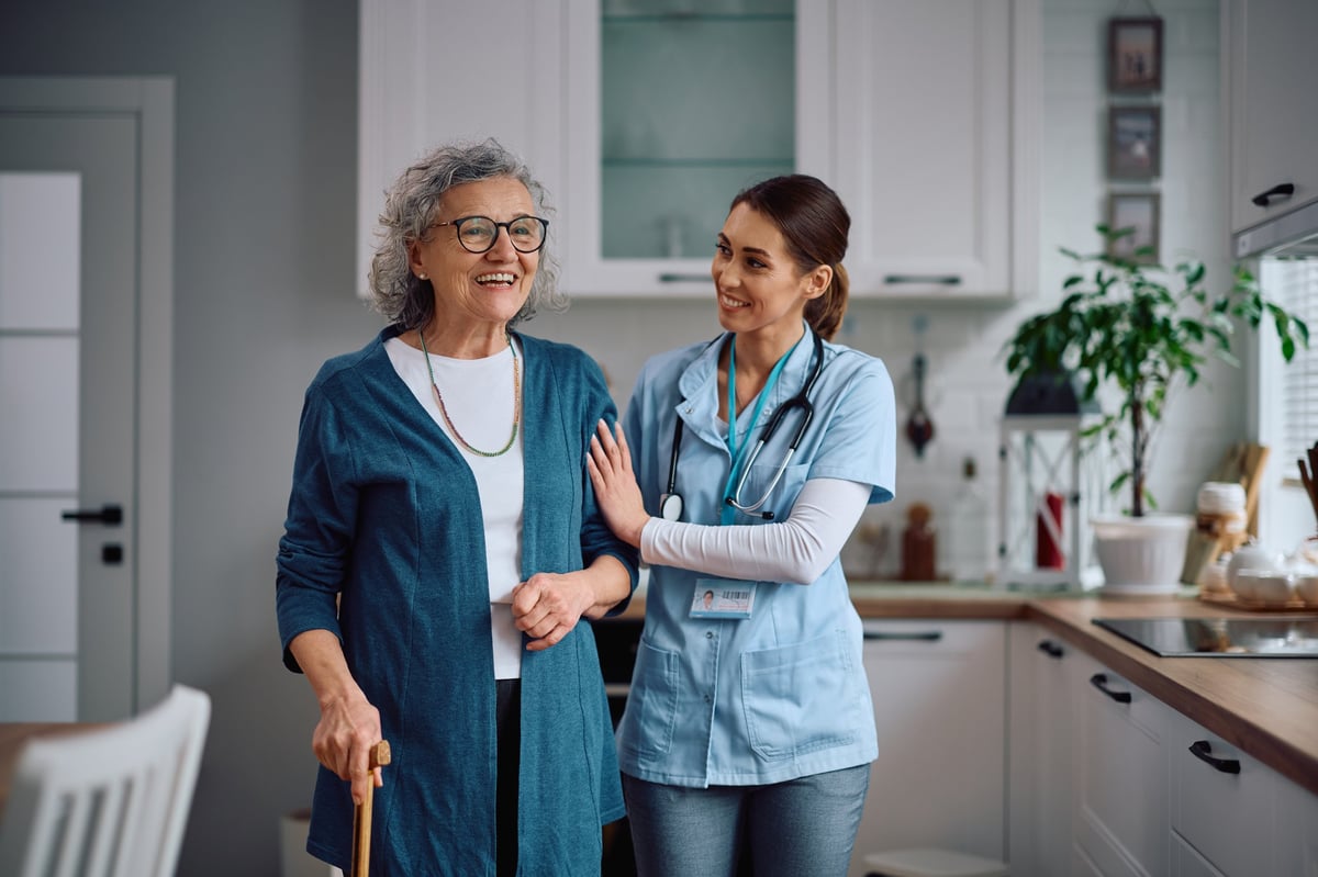 Caregiver assisting senior at home