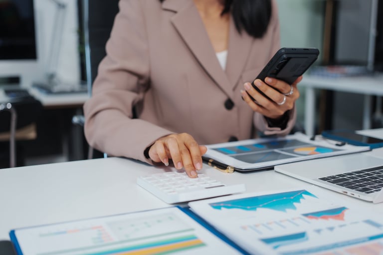 Professional bookkeeper reviewing financial documents