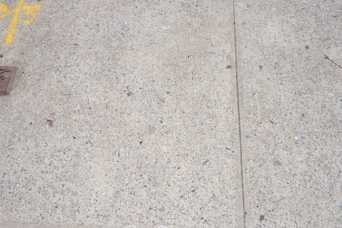 Clean stone sidewalk after pressure washing