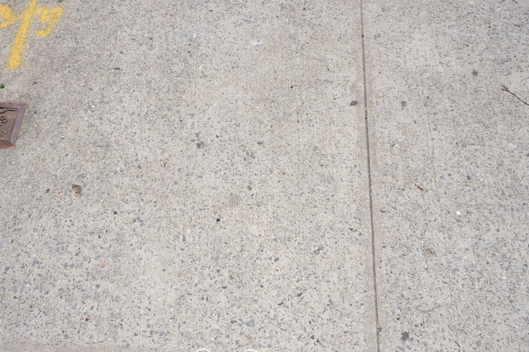 Clean stone sidewalk after pressure washing
