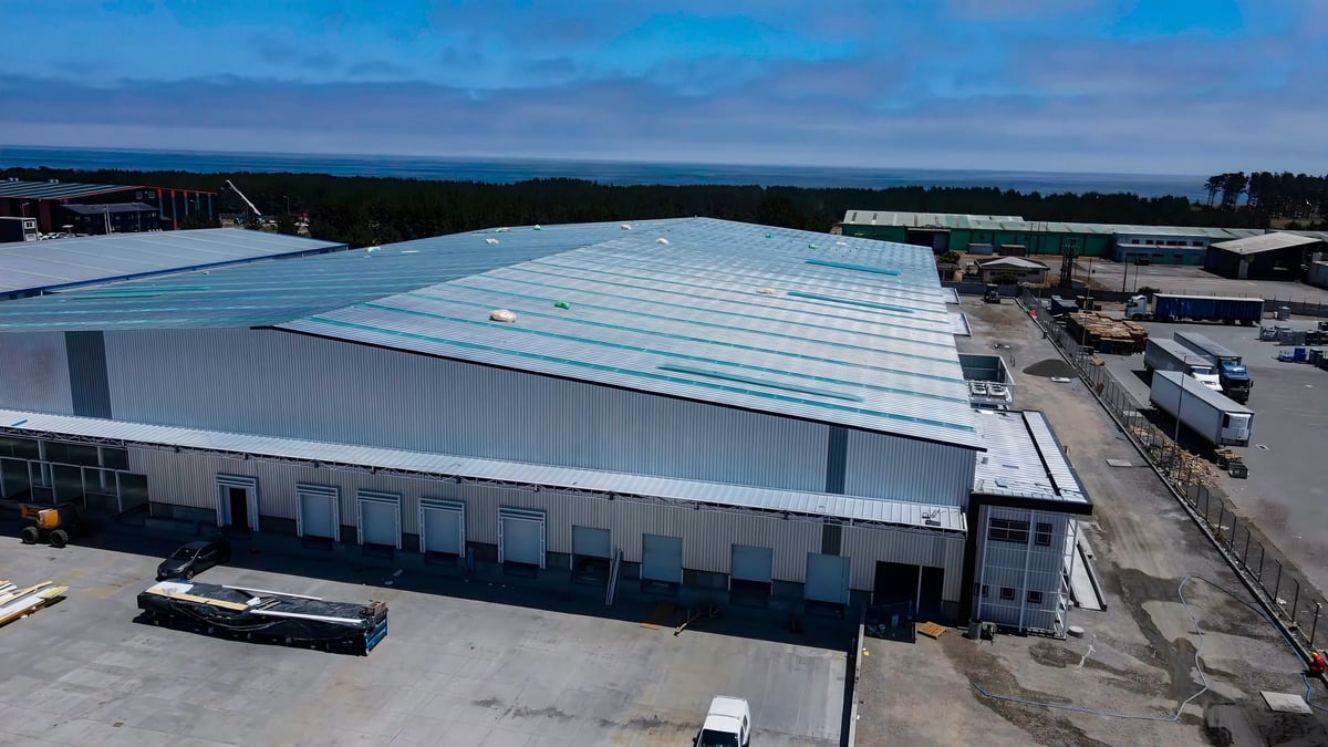 Commercial warehouse construction with metal structure and roofing