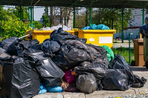 Overflowing municipal waste container
