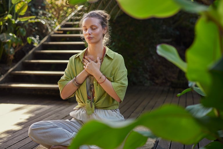 Woman meditating peacefully in nature, practicing mindfulness