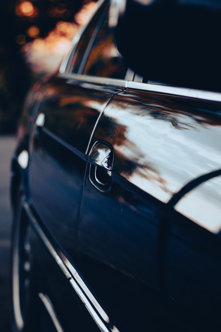 Old black german car on the city street