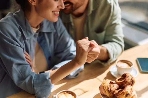Happy couple holding hands, romantic connection