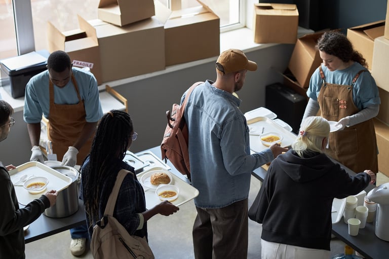 Volunteers serving food at a community center