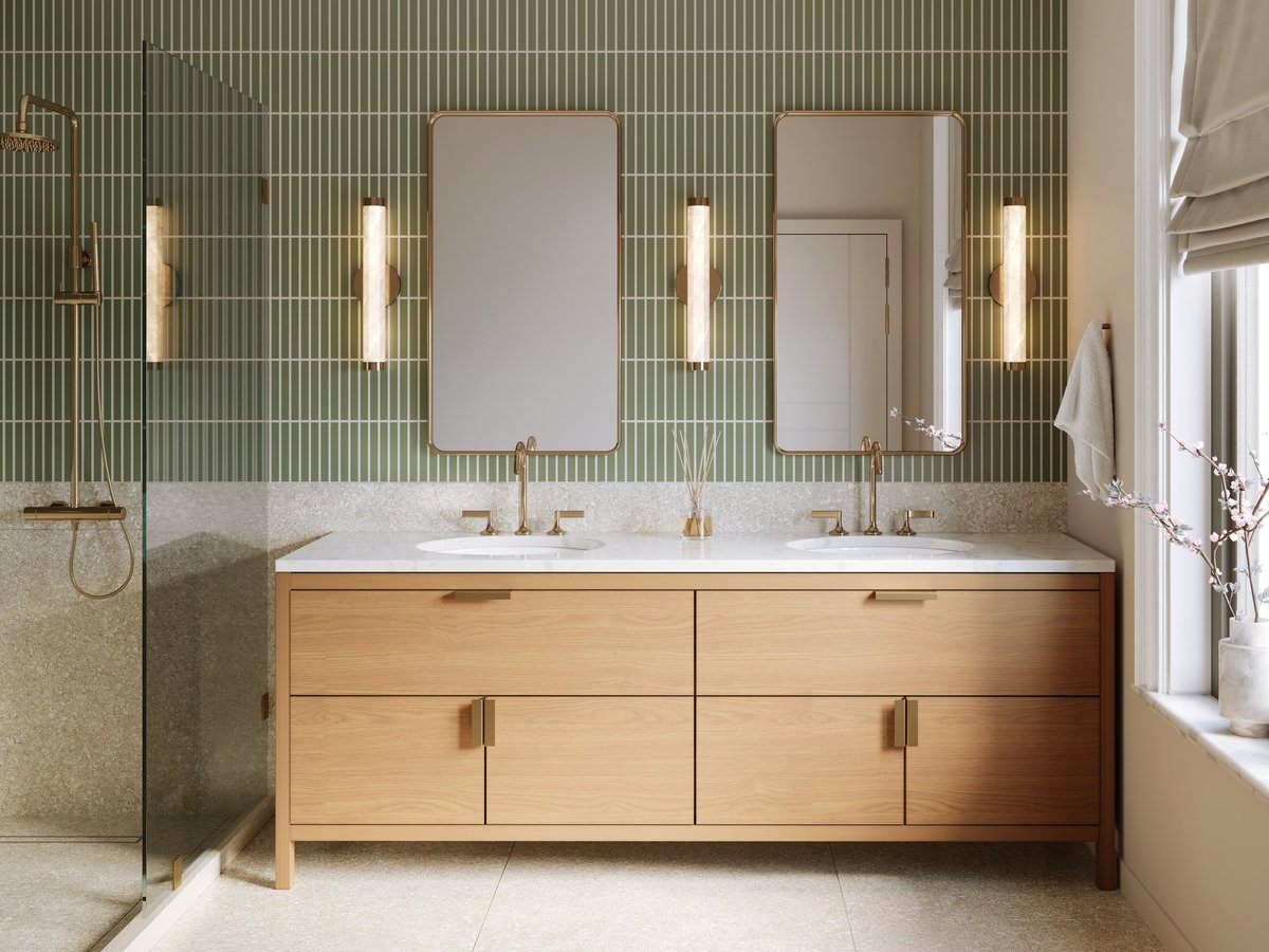 A modern bathroom with green wall tile and terrazzo wall and floor tile, brass plumbing fixtures, brass mirrors and marble countertop — an eclectic luxurious design