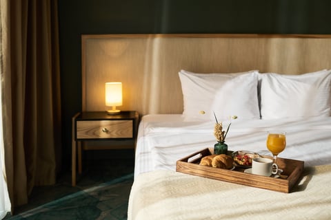 Breakfast tray on cozy hotel bed