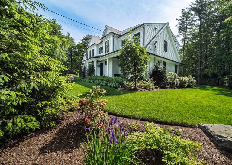 Side front garden of suburban home in spring