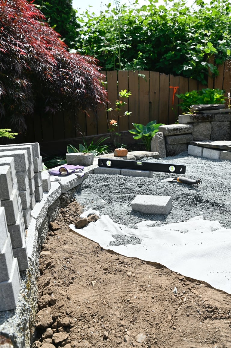 Outdoor home renovation hardscape gardening using rocks, blocks, gravel, dirt and construction materials