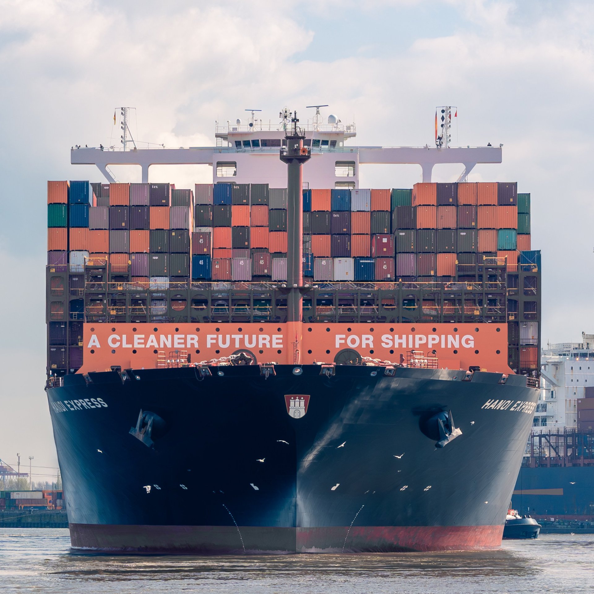 Cargo ship at sunrise — global logistics and maritime shipping