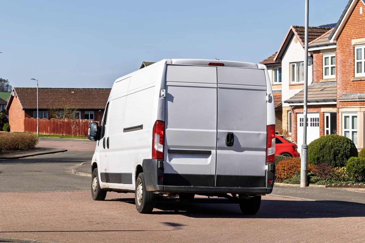 White delivery van on a residential street