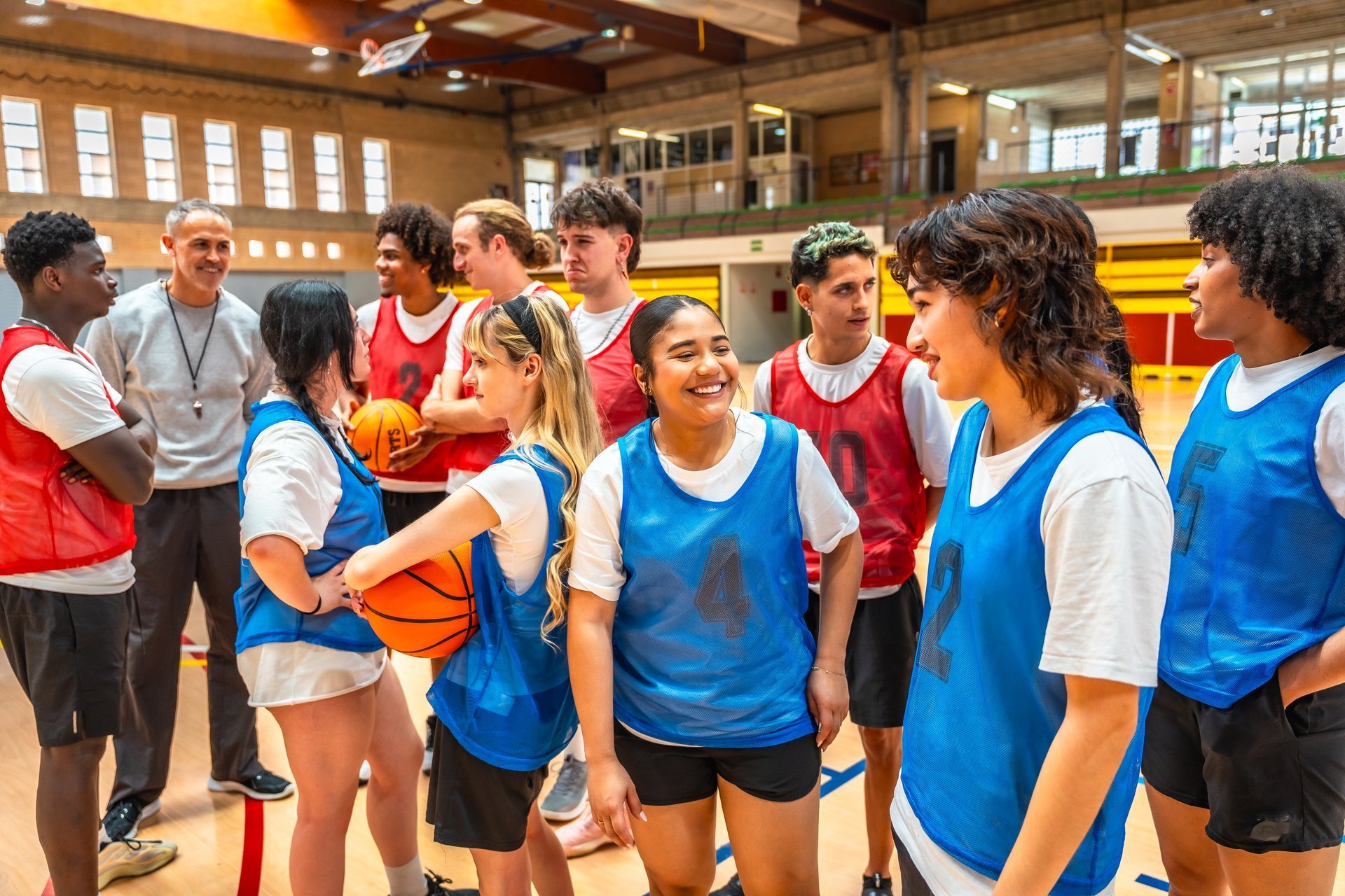 Lighthouse student-athletes listening to their coach during a team practice