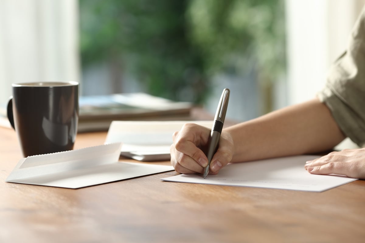 Notebook with handwritten brand strategy planning on a desk