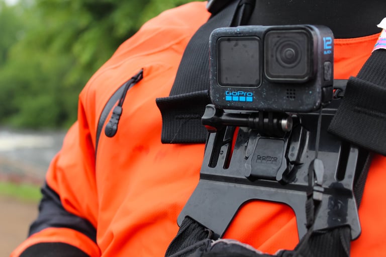GoPro action camera mounted on chest harness for paddling sports footage