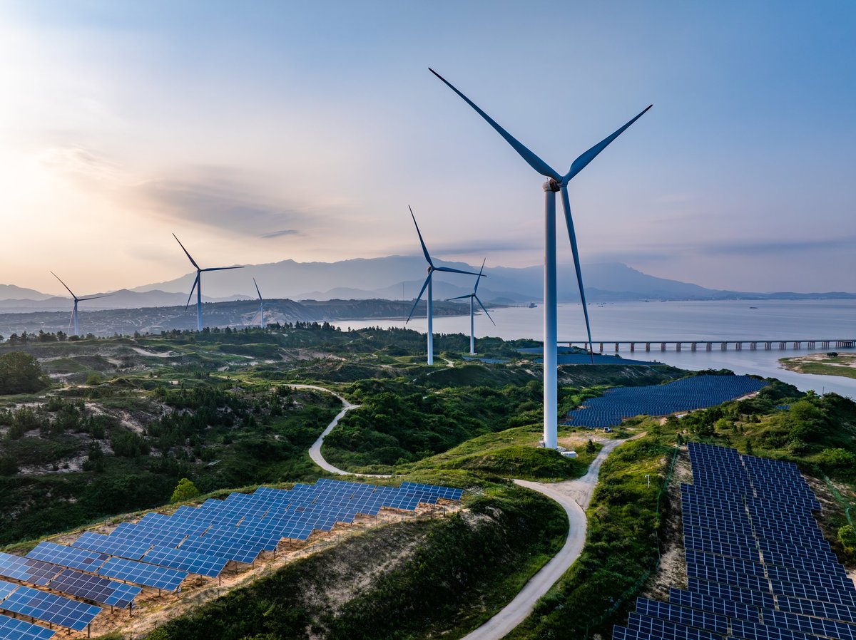 Photovoltaic solar energy wind power new energy at sunset.