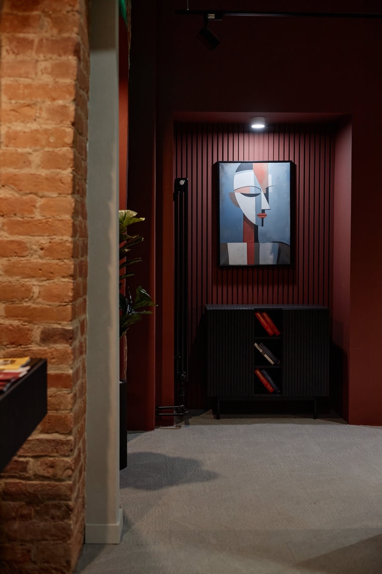 Abstract art on freshly painted dark accent wall with modern decor