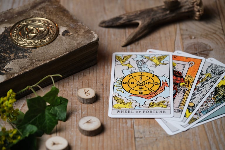 Rider Waite tarot cards spread on wooden table with mystical atmosphere