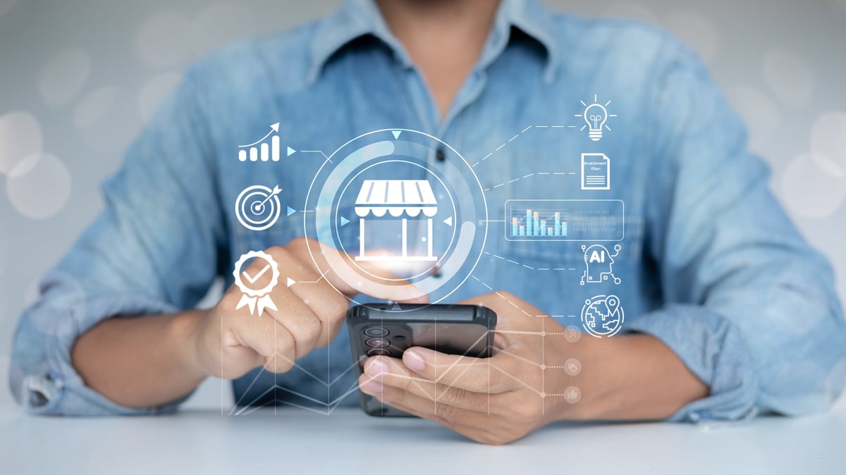 Business owner using a smartphone with digital marketing and local search icons
