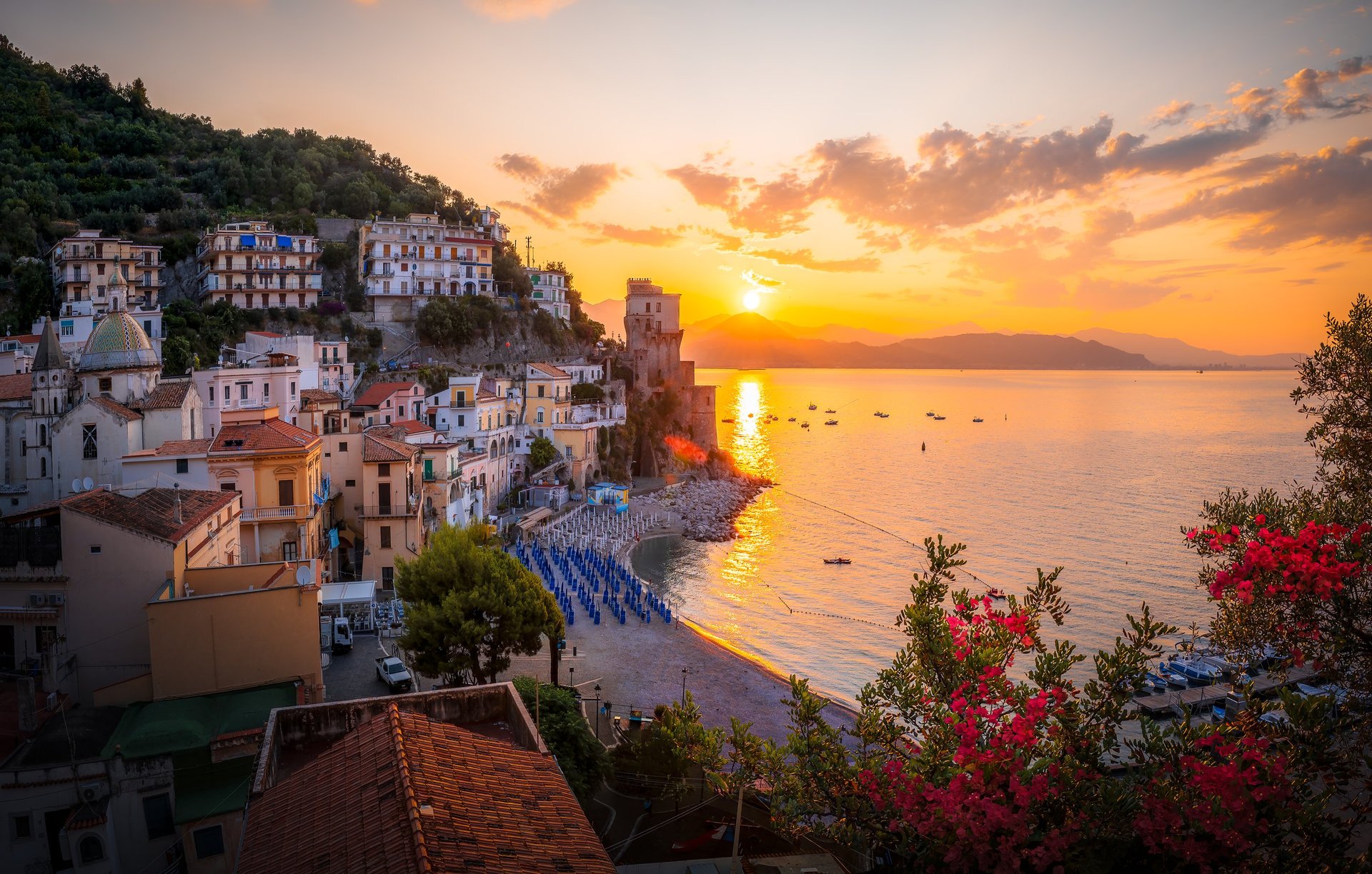 Elegant Mediterranean coastal town at sunrise overlooking the azure sea