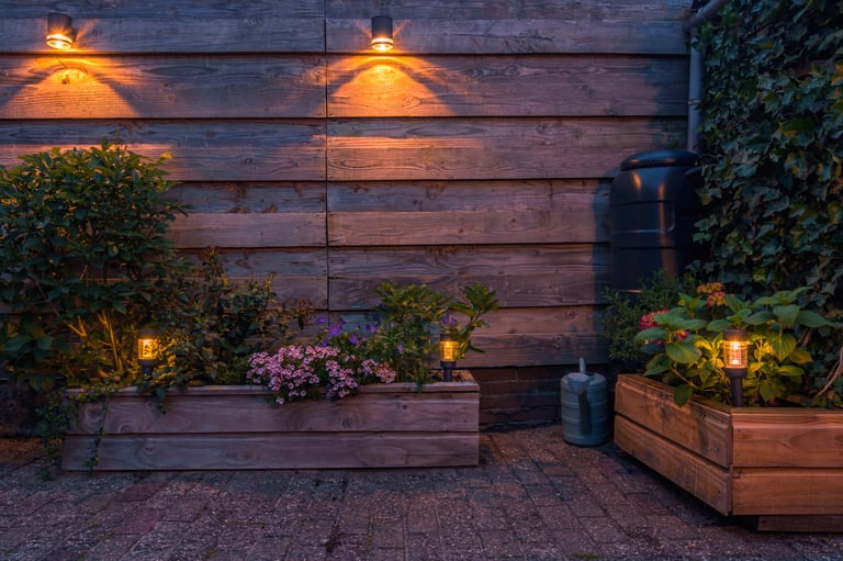 Solar-powered outdoor lighting illuminating a garden with flowers and plants
