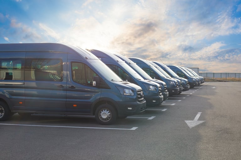 Rows of commercial vans parked in formation