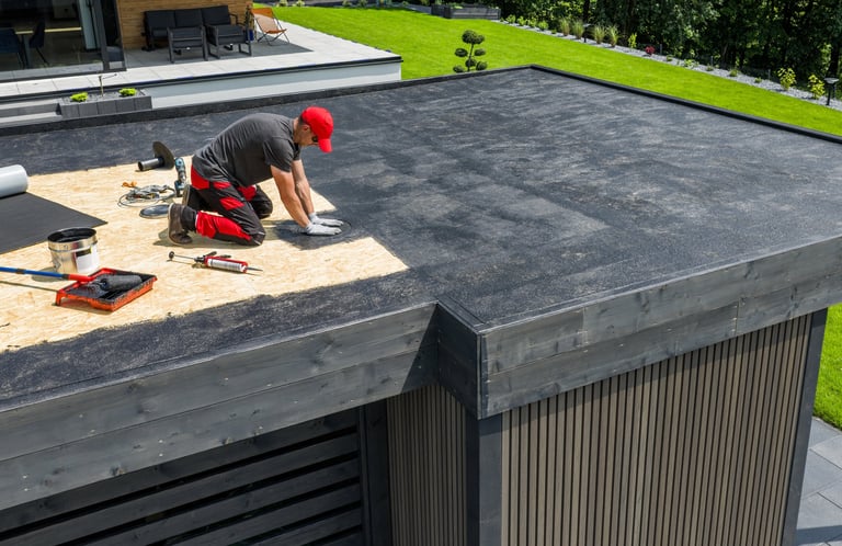 EPDM flat roof installation on modern home