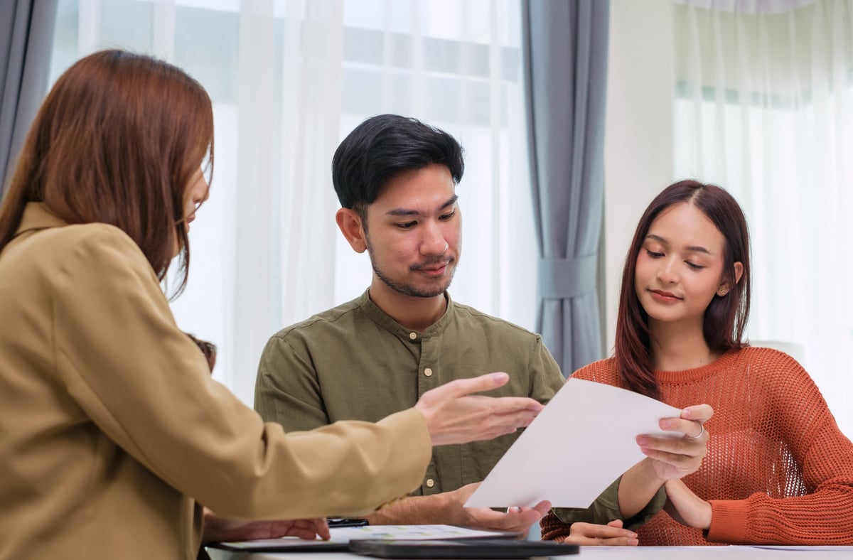 Financial advisor reviewing credit and loan options with a couple