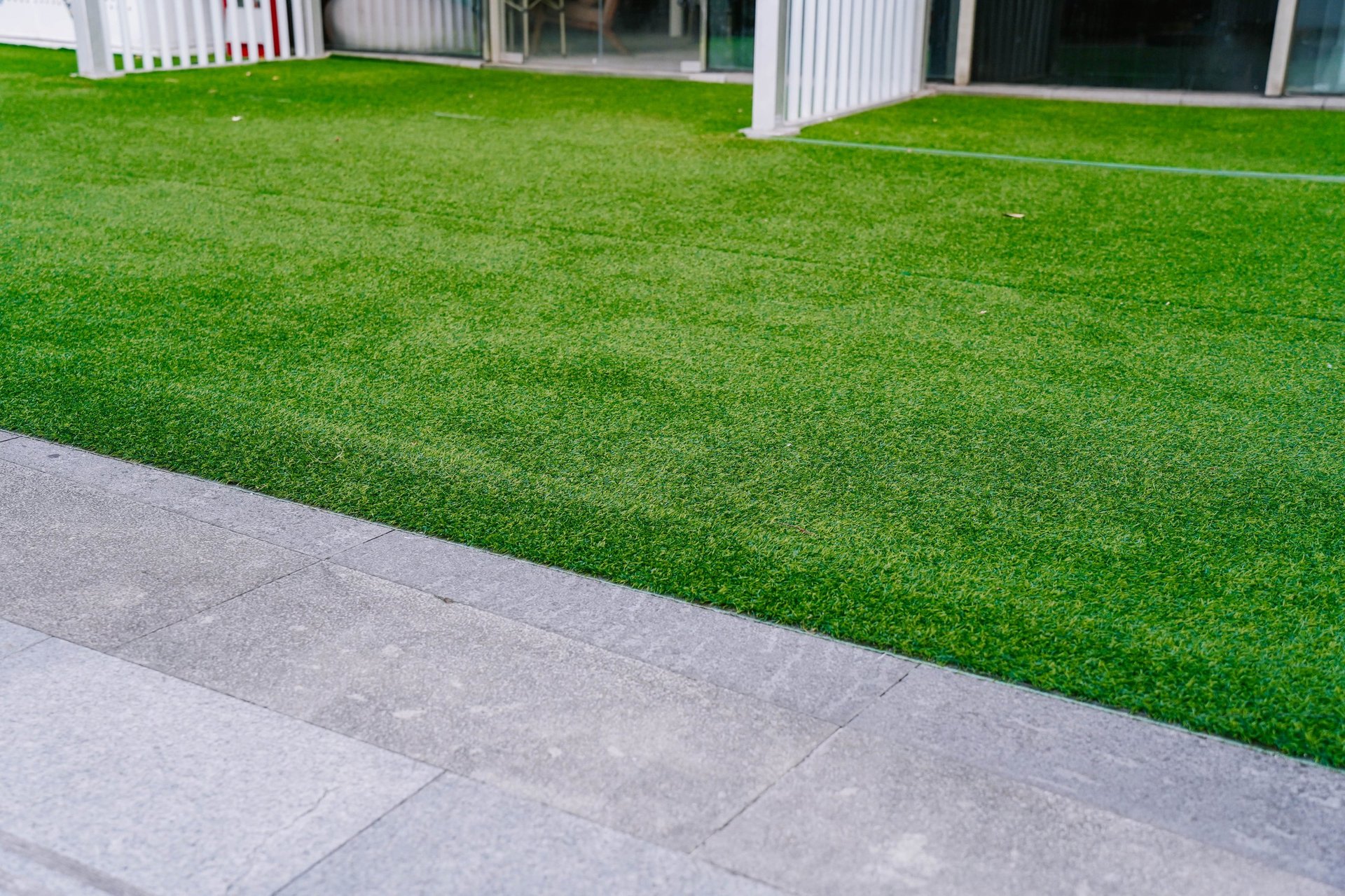 Artificial grass lawn turf in modern building front yard