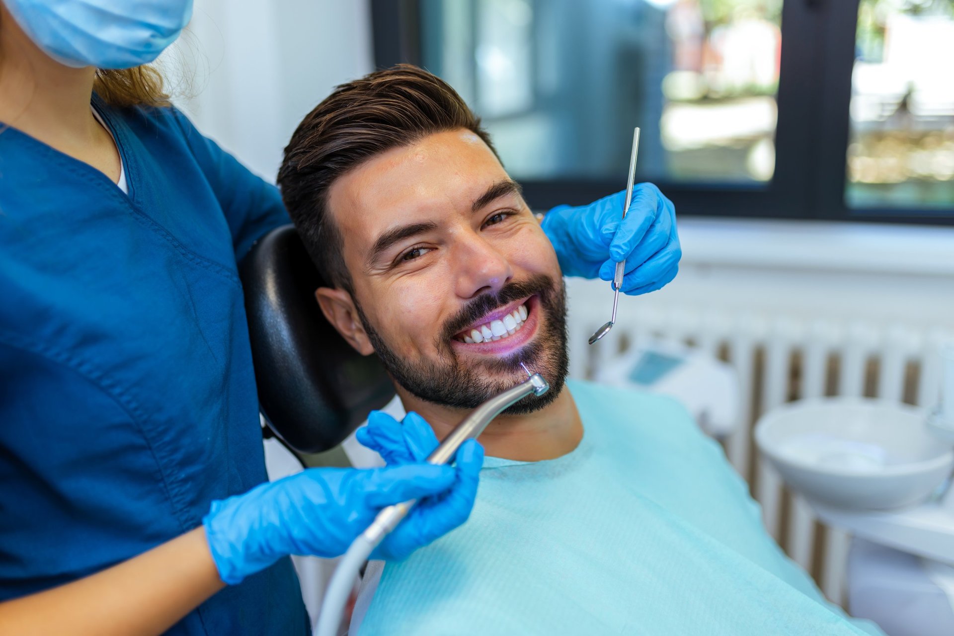 Dentist performing a same-day dental treatment on a patient in a modern clinic