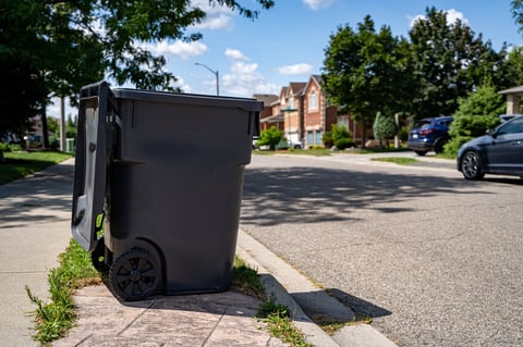 95-gallon waste cart on a residential sidewalk