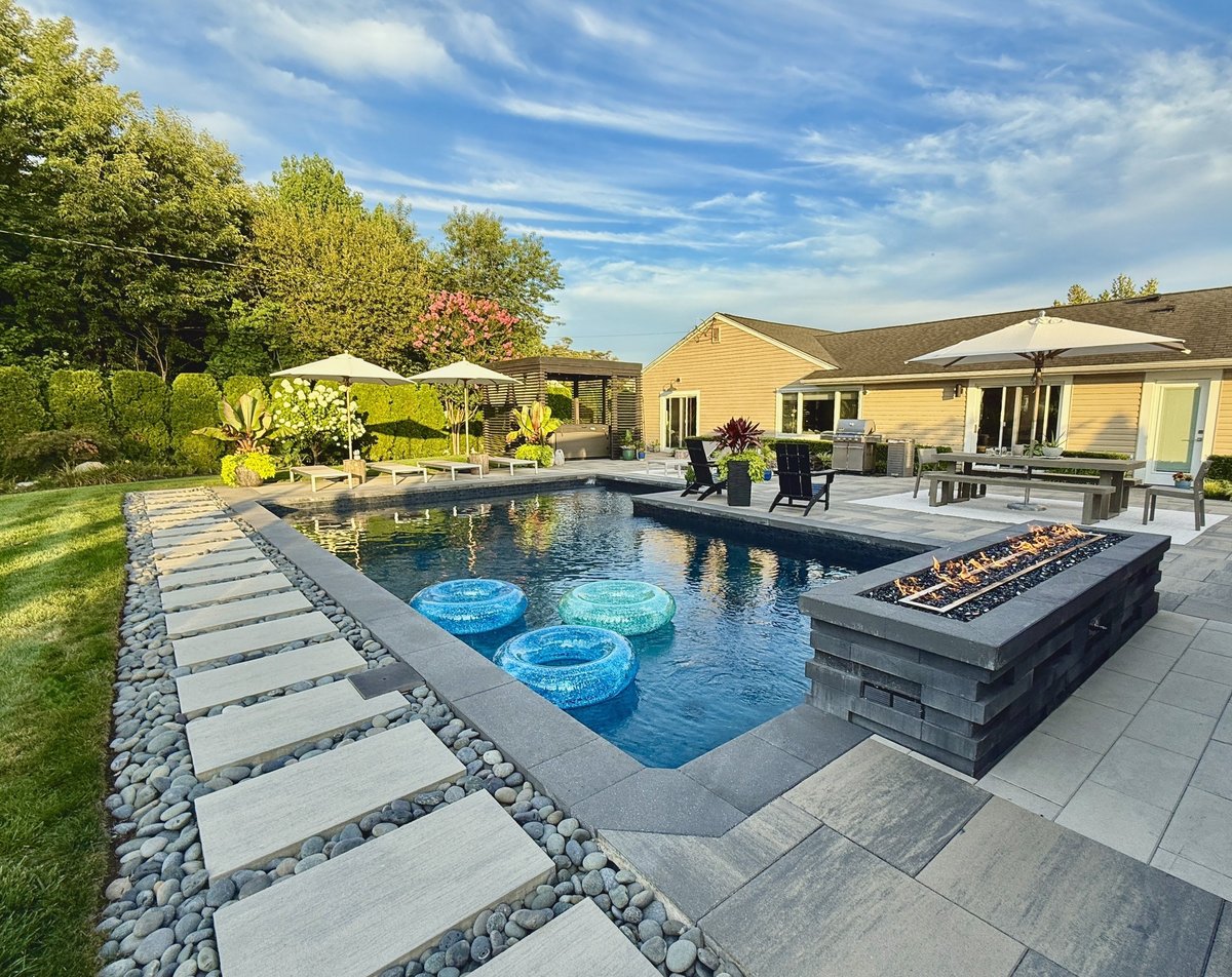 Luxurious high-end home landscape with outdoor lounge seating, residential landscaping in Massachusetts
