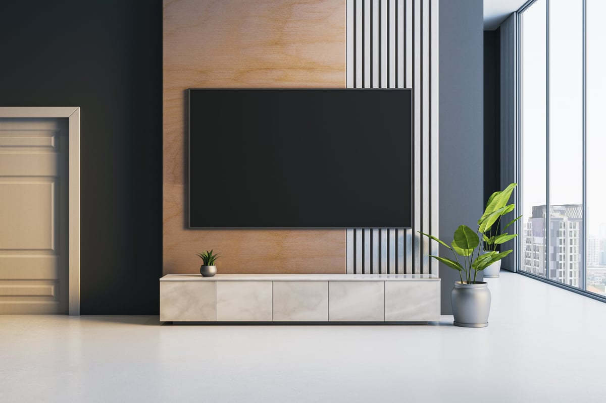Sala moderna con mueble para TV y decoración contemporánea ideal para Airbnb