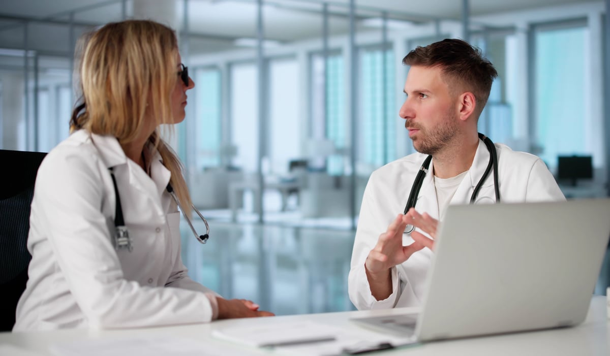 Medical professionals conducting a face-to-face interview in a hospital