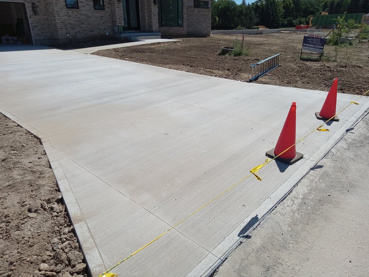 Fresh concrete driveway after professional cleaning
