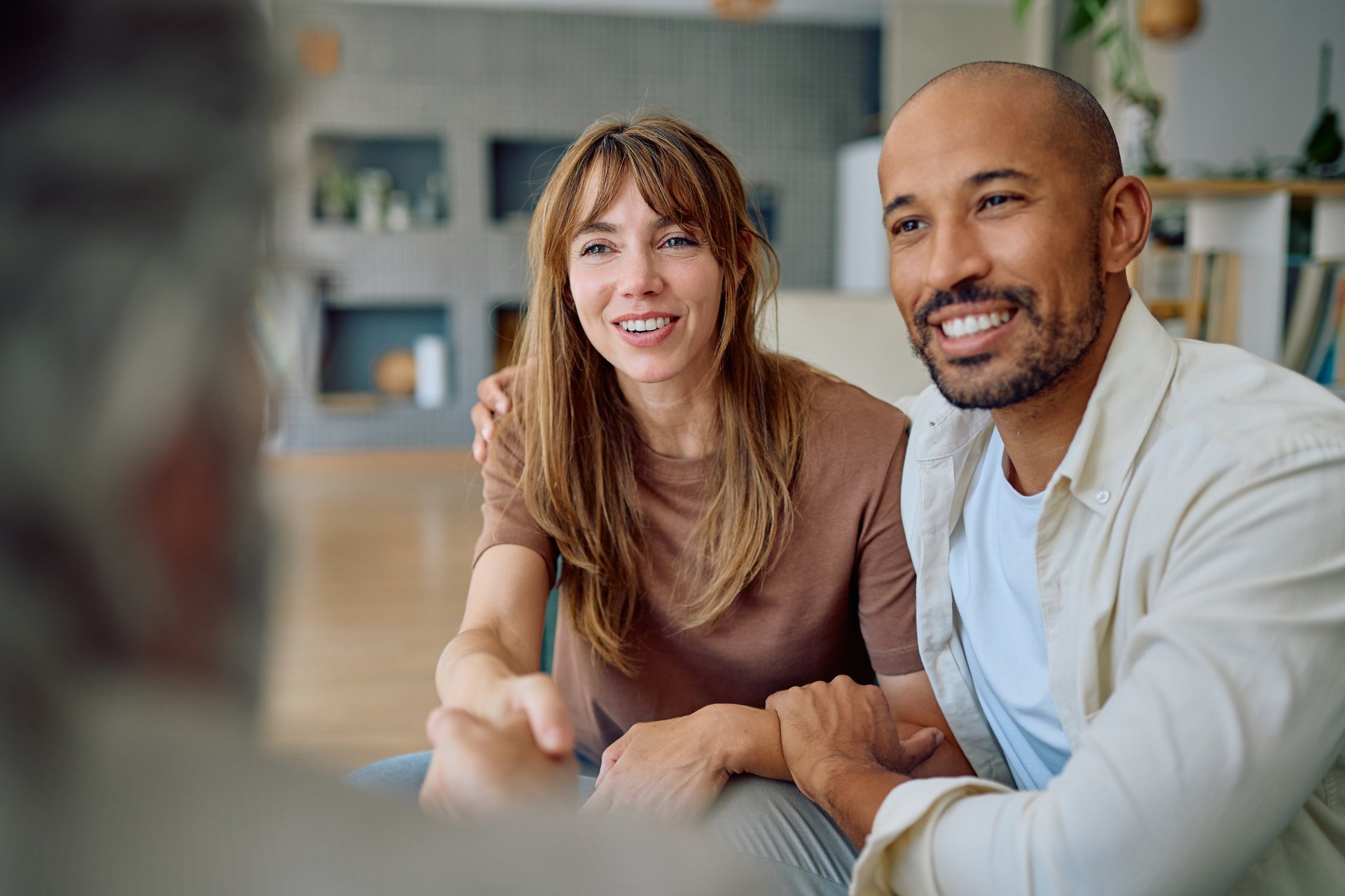 Couple discussing financial planning with consultant