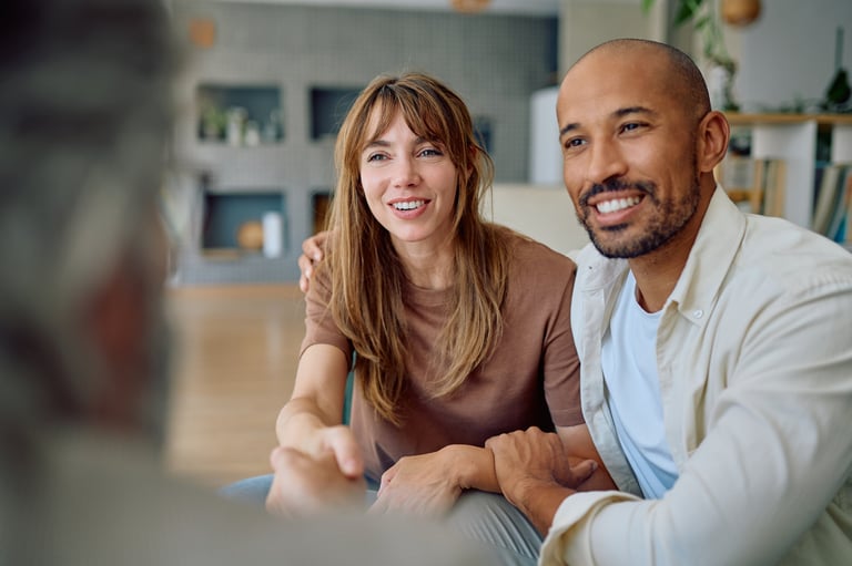 Couple discussing financial planning with advisor