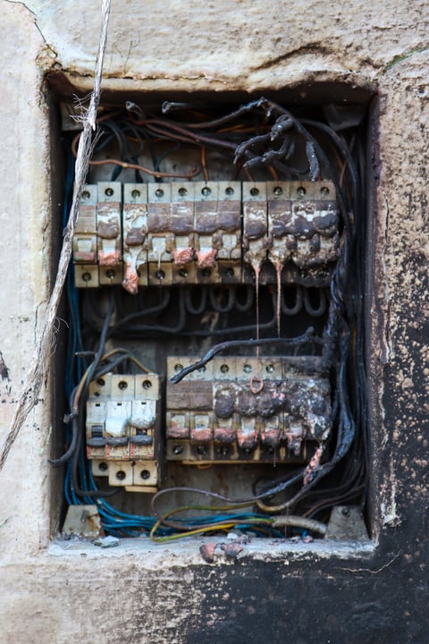 Melted fuse panel after electrical fire — CN Electrical safety inspection services in Chilliwack, BC