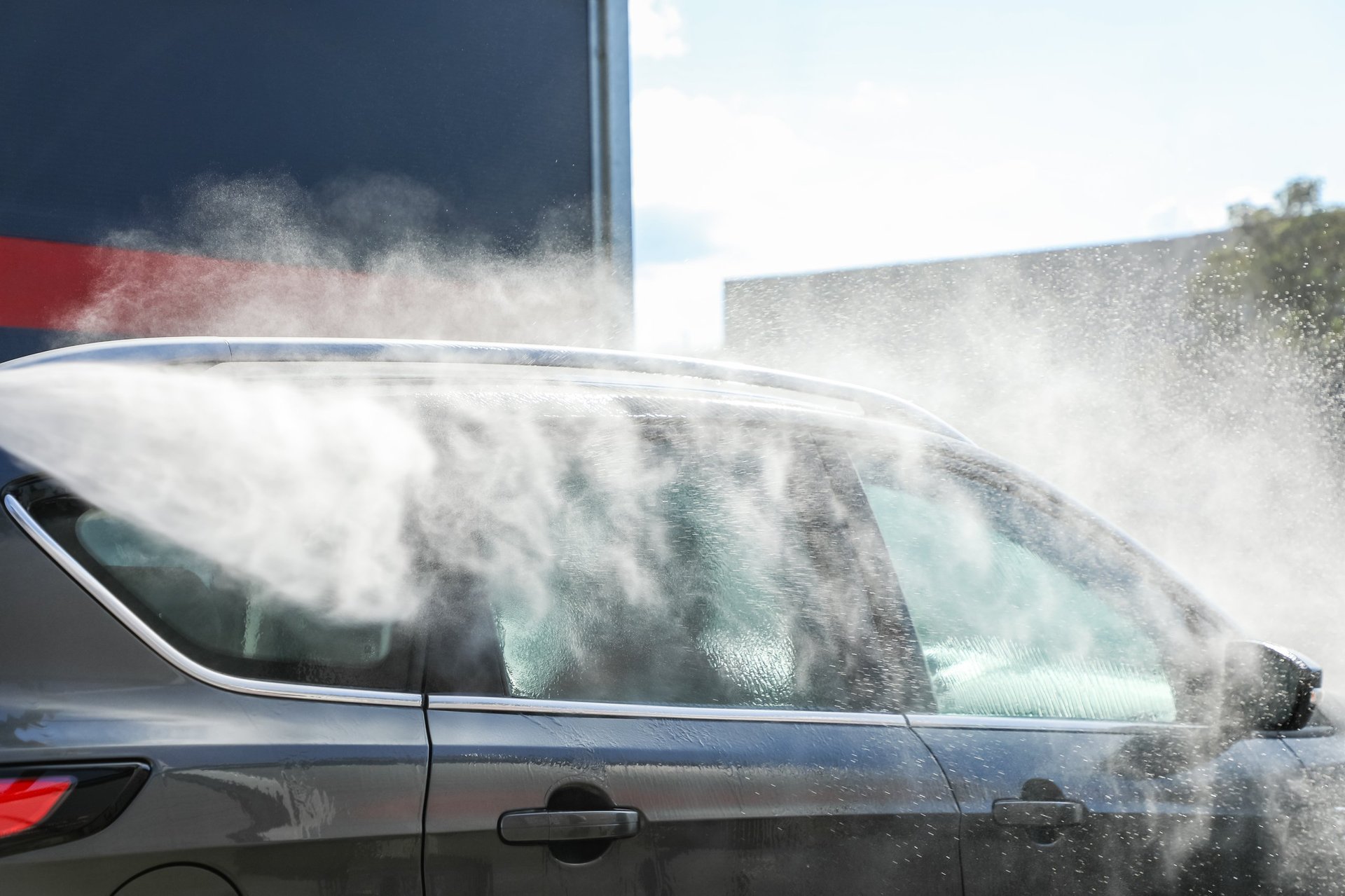 Professional car detailing with high-pressure cleaning