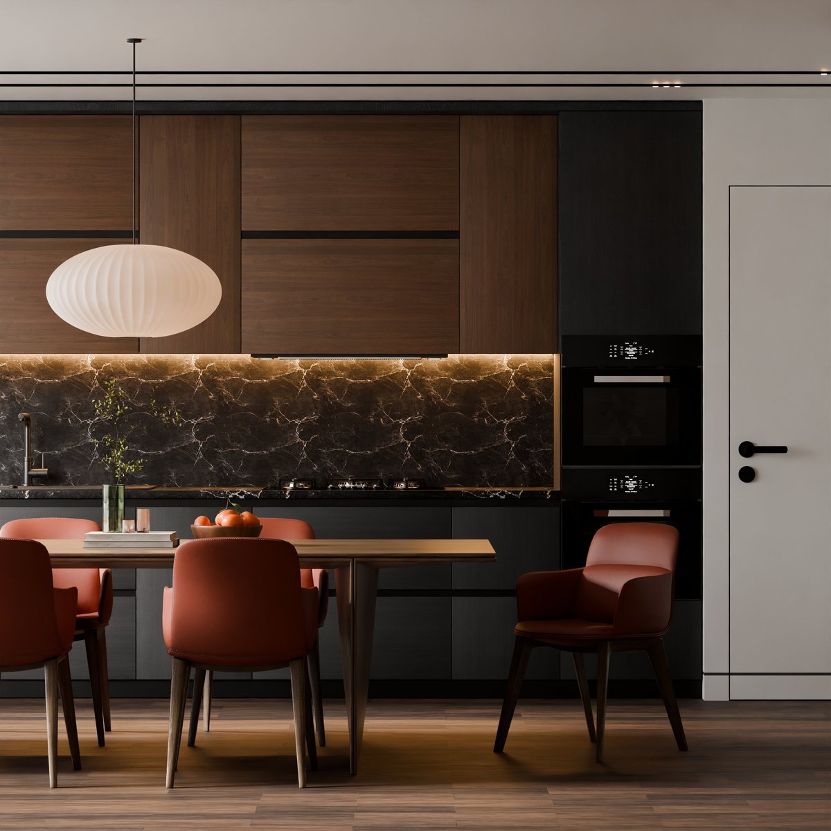 Cocina premium contemporánea con isla de mármol, gabinetes de madera oscura, iluminación cálida y comedor con sillas terracota