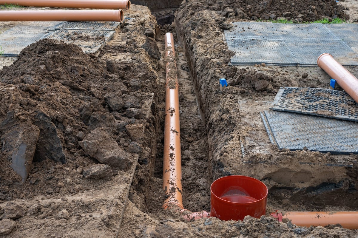 Sewer pipe installation at construction site