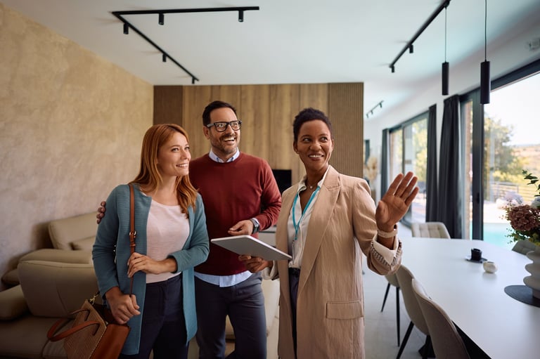 Happy real estate agent with couple
