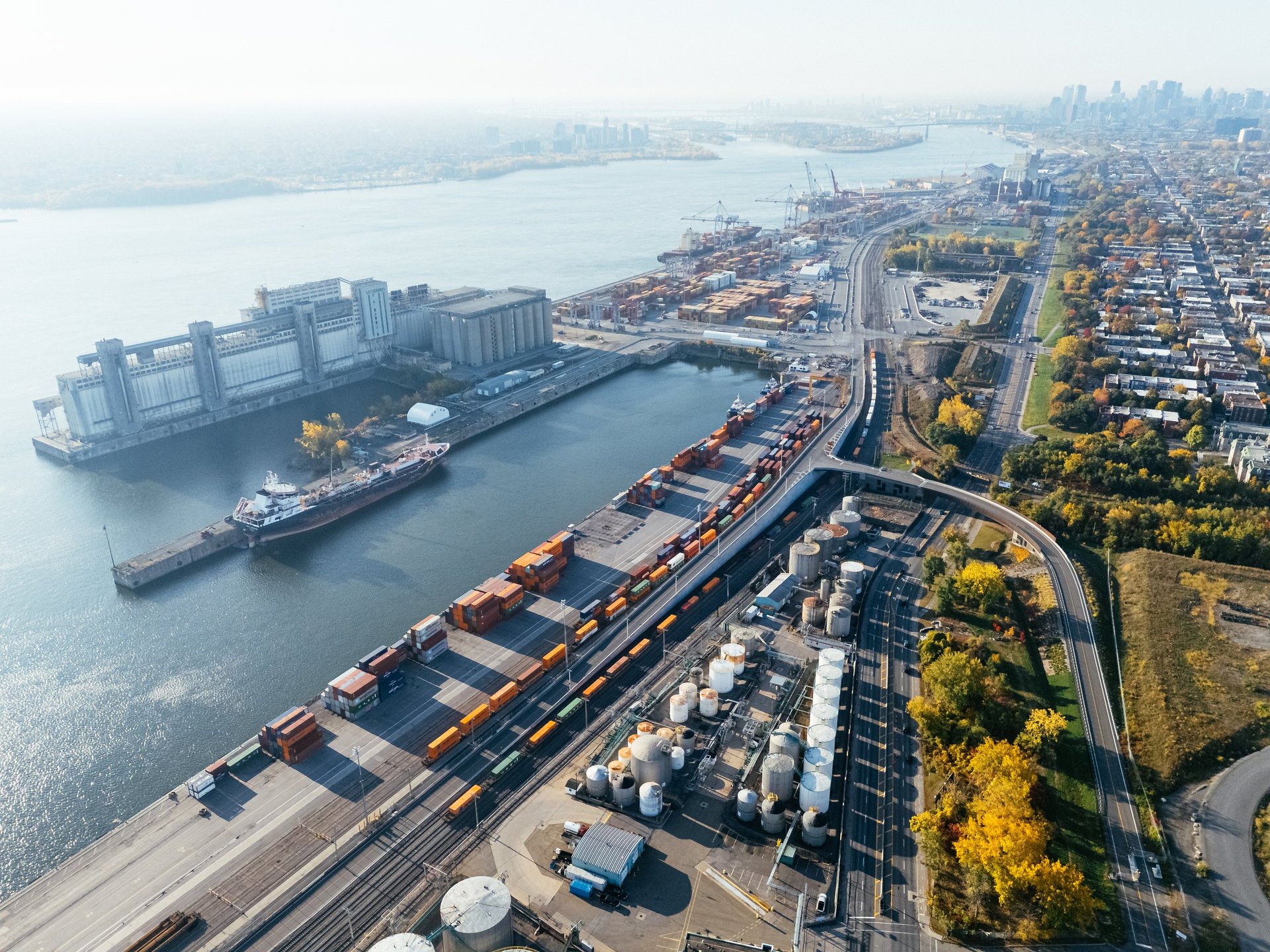 An industrial container yard and equipment staging area, representing commercial equipment available through CBB Group