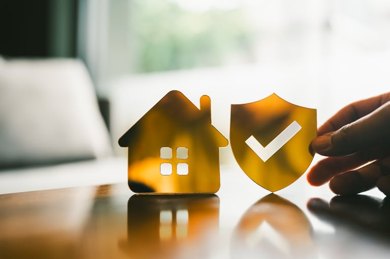 Golden shield with home icon symbolizing family protection