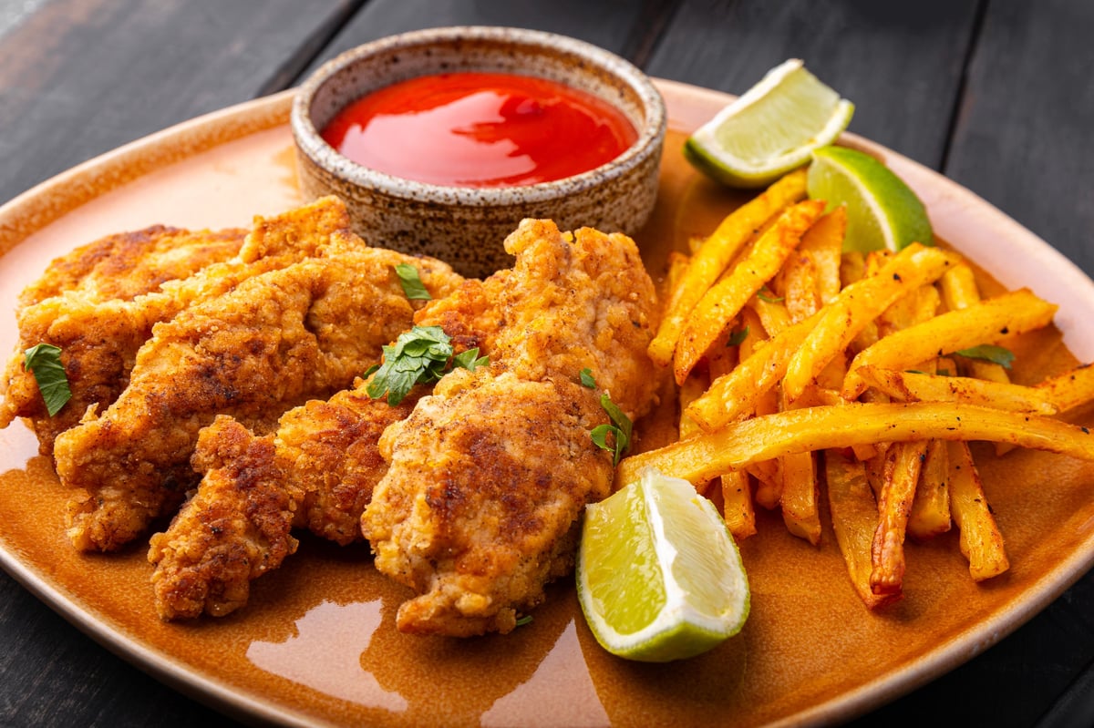 Homemade crispy chicken tenders with fries